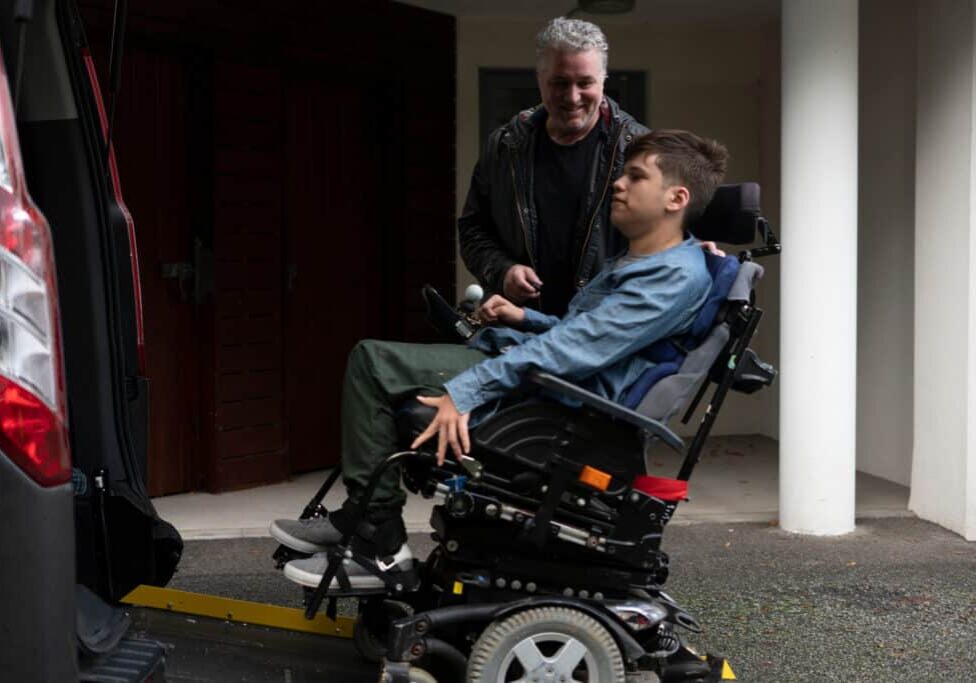 Disabled boy Using Wheelchair Lift