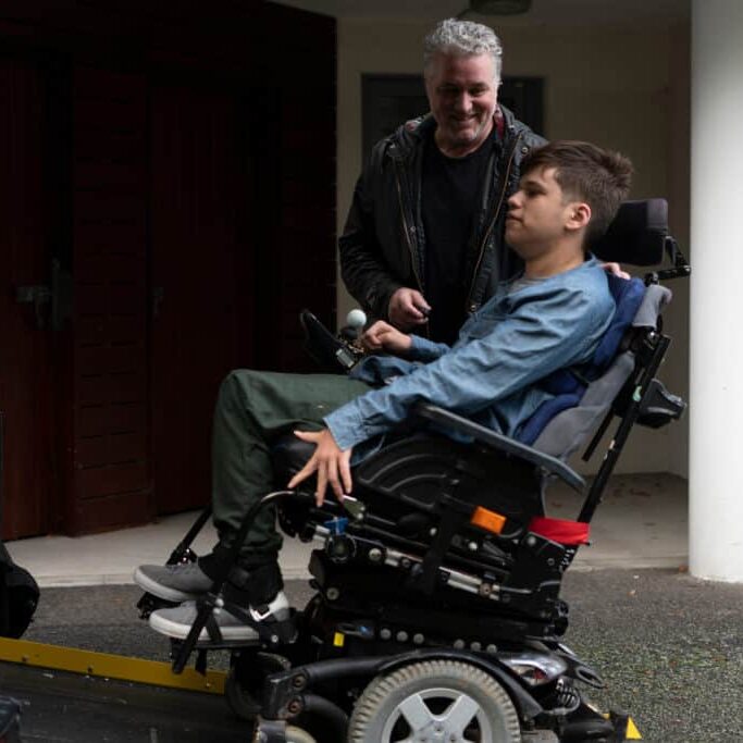 Disabled boy Using Wheelchair Lift